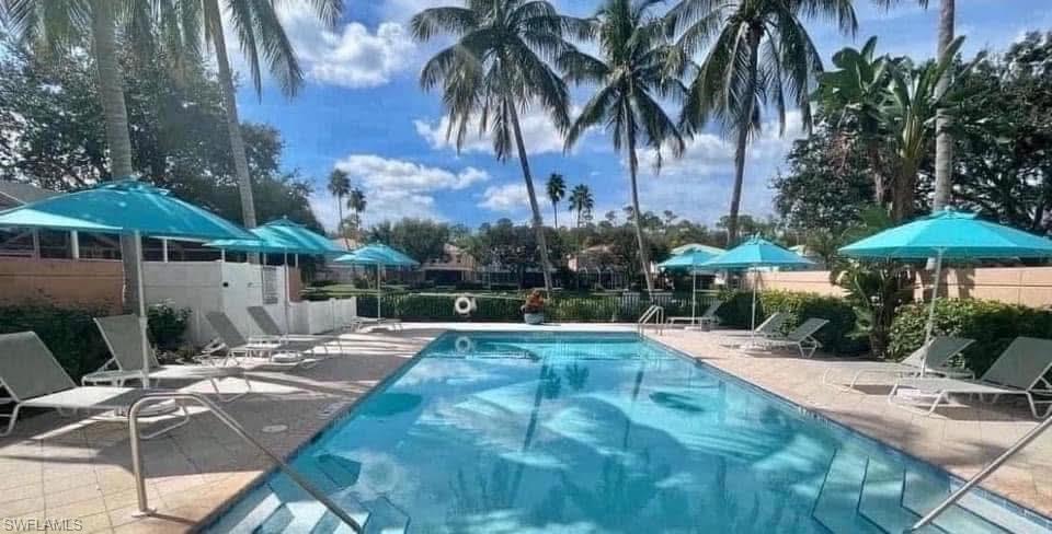 5733 Cove Circle Naples, FL 34119 - Photo 29 of 33 COMMUNITY HEATED POOL
