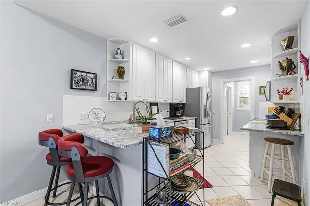 a view of a kitchen and dining area