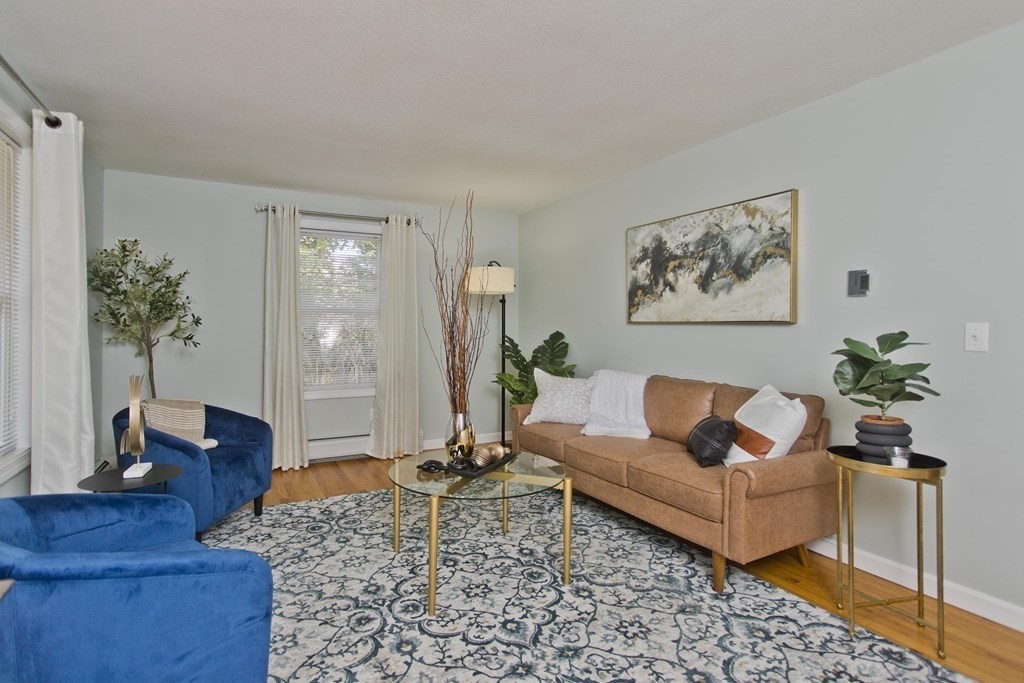 418 Ryan Road Northampton, MA 01062 - Photo 19 of 36 a living room with furniture and a potted plant