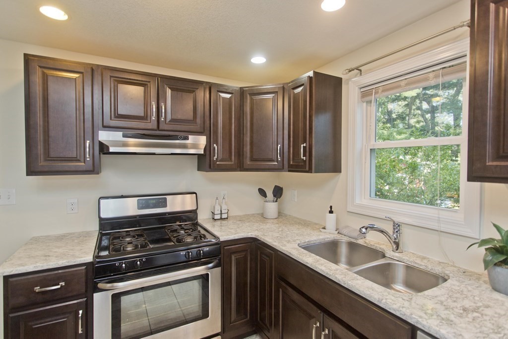 418 Ryan Road Northampton, MA 01062 - Photo 30 of 36 a kitchen with stainless steel appliances granite countertop a sink stove and cabinets