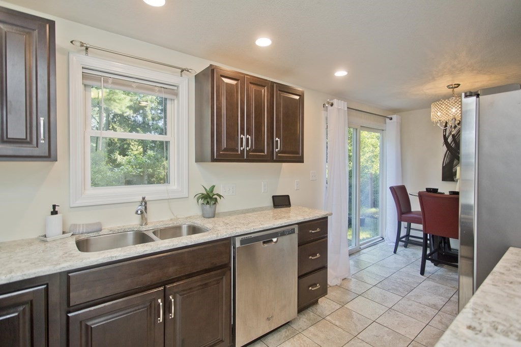 418 Ryan Road Northampton, MA 01062 - Photo 31 of 36 a kitchen with a sink cabinets and window