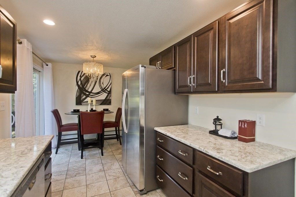 418 Ryan Road Northampton, MA 01062 - Photo 32 of 36 a kitchen with stainless steel appliances granite countertop a sink and cabinets