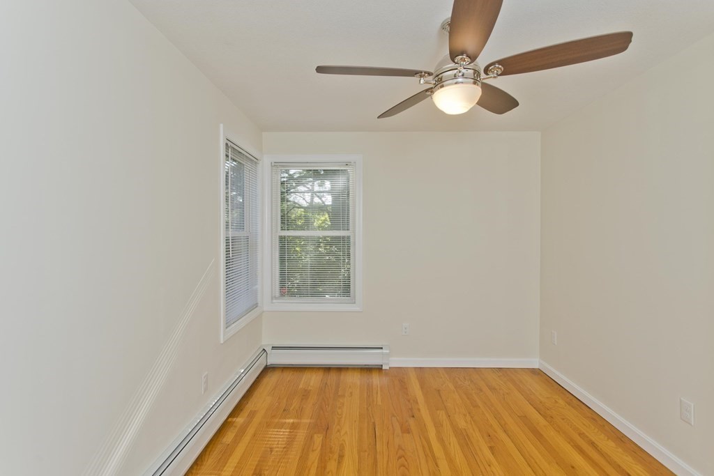418 Ryan Road Northampton, MA 01062 - Photo 8 of 36 an empty room with a window and a fan