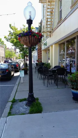 a view of a street that has couple of cars parked on the road