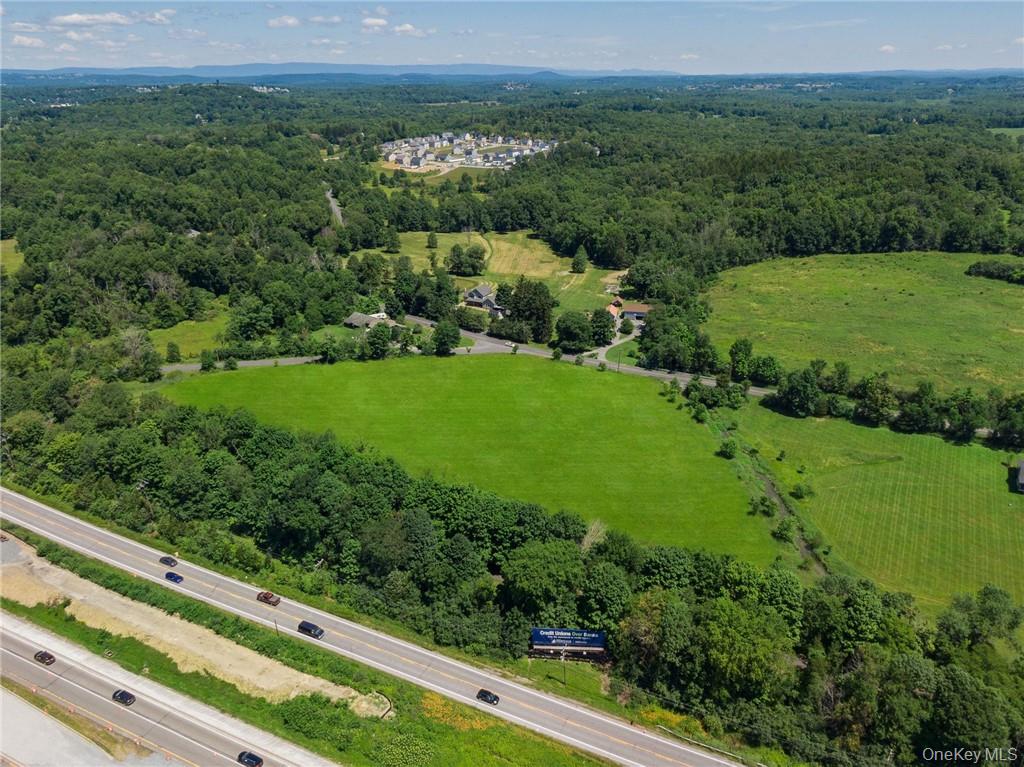 Tbd Old Chester & Duck Farm Road Goshen, NY 10924 - Photo 8 of 35 a view of a lush green forest with a lake and trees