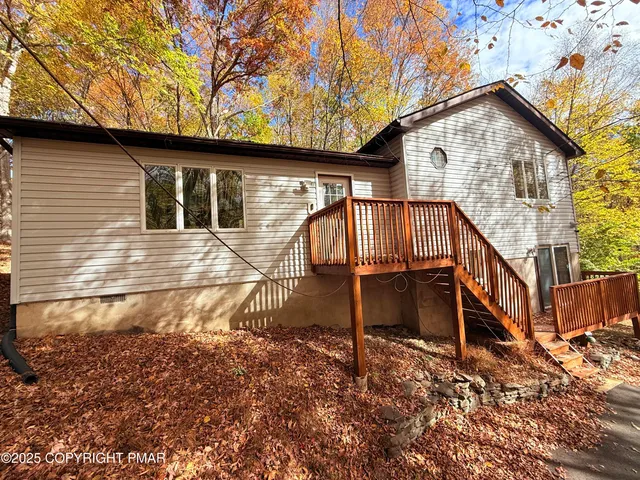 a view of house with a yard