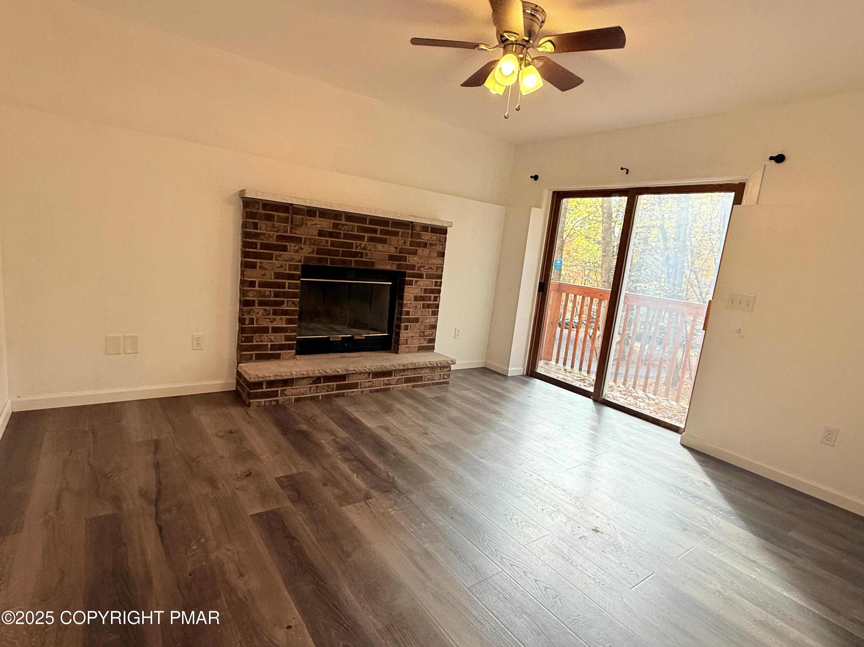 303 Otter Court Bushkill, PA 18324 - Photo 14 of 18 wooden floor in an empty room with a window
