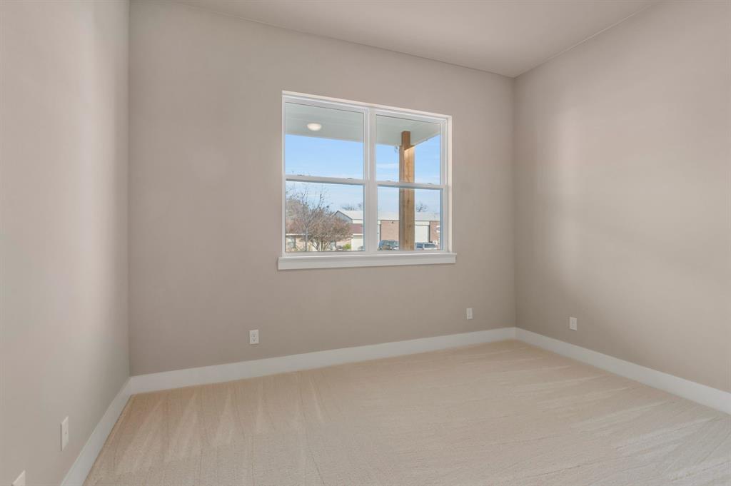 207 West 7th Street Justin, TX 76247 - Photo 33 of 40 an empty room with a window