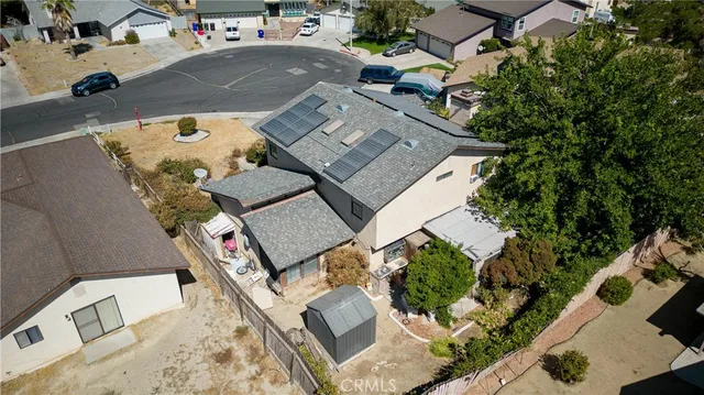 an aerial view of a house with swimming pool