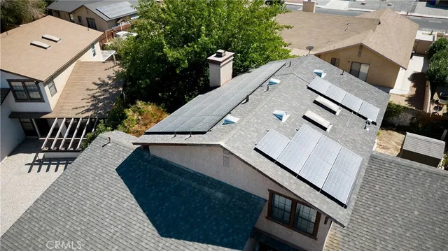 an aerial view of residential building and ocean