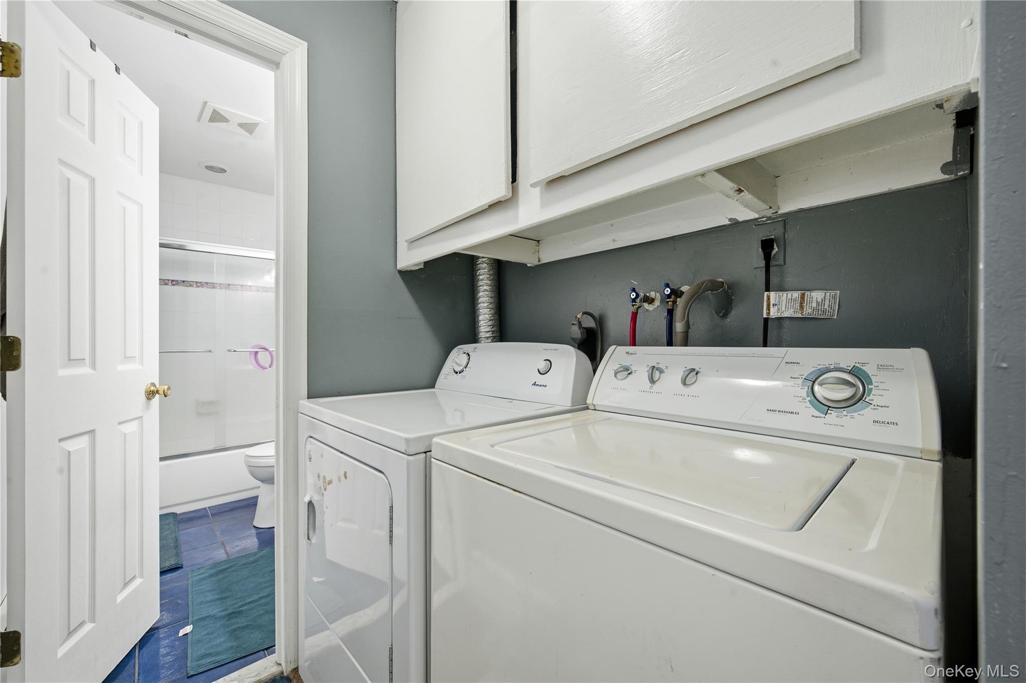 50 Rustic Avenue Medford, NY 11763 - Photo 11 of 20 a utility room with dryer and washer