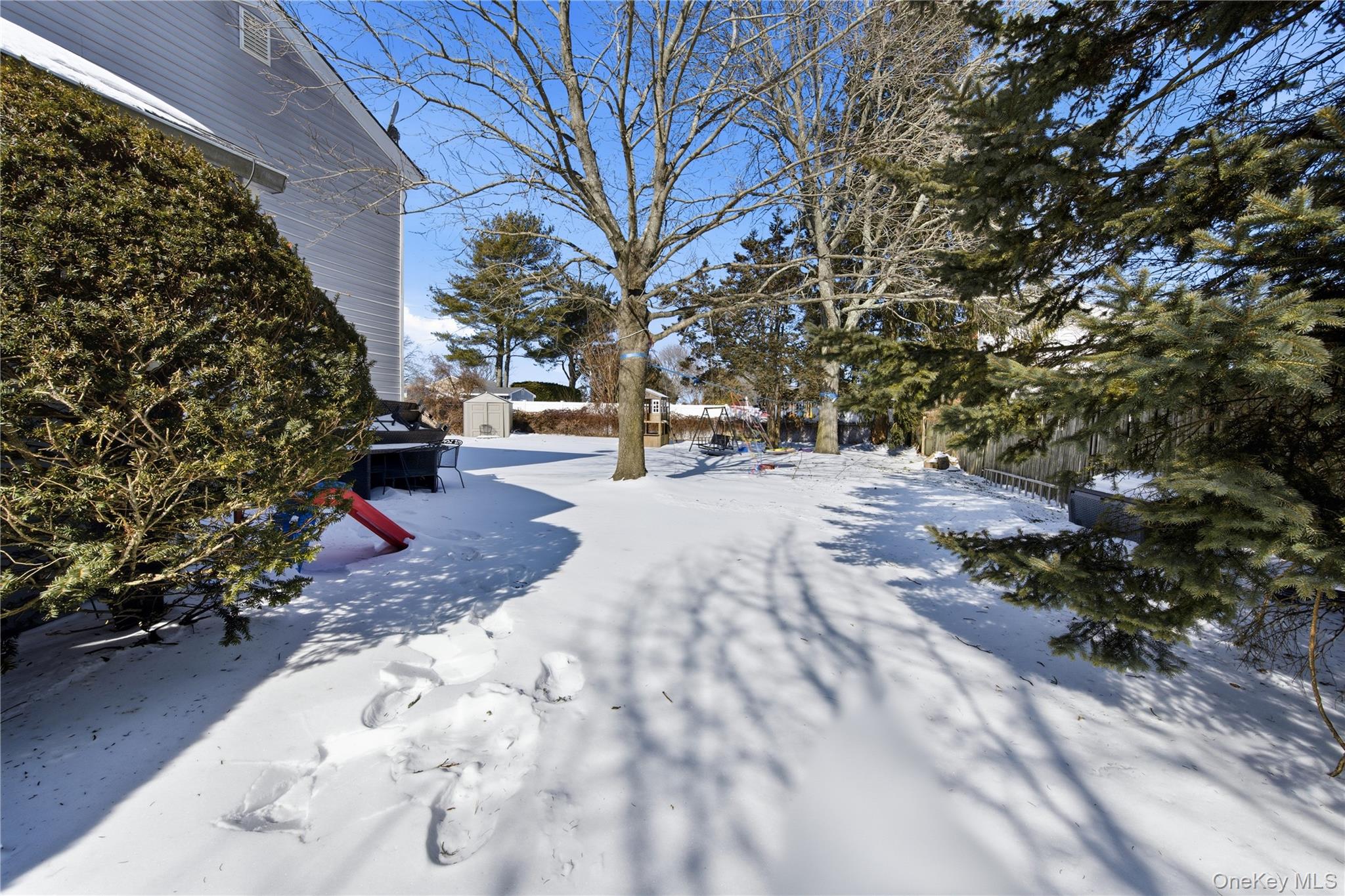 50 Rustic Avenue Medford, NY 11763 - Photo 13 of 20 a view of a backyard with large trees