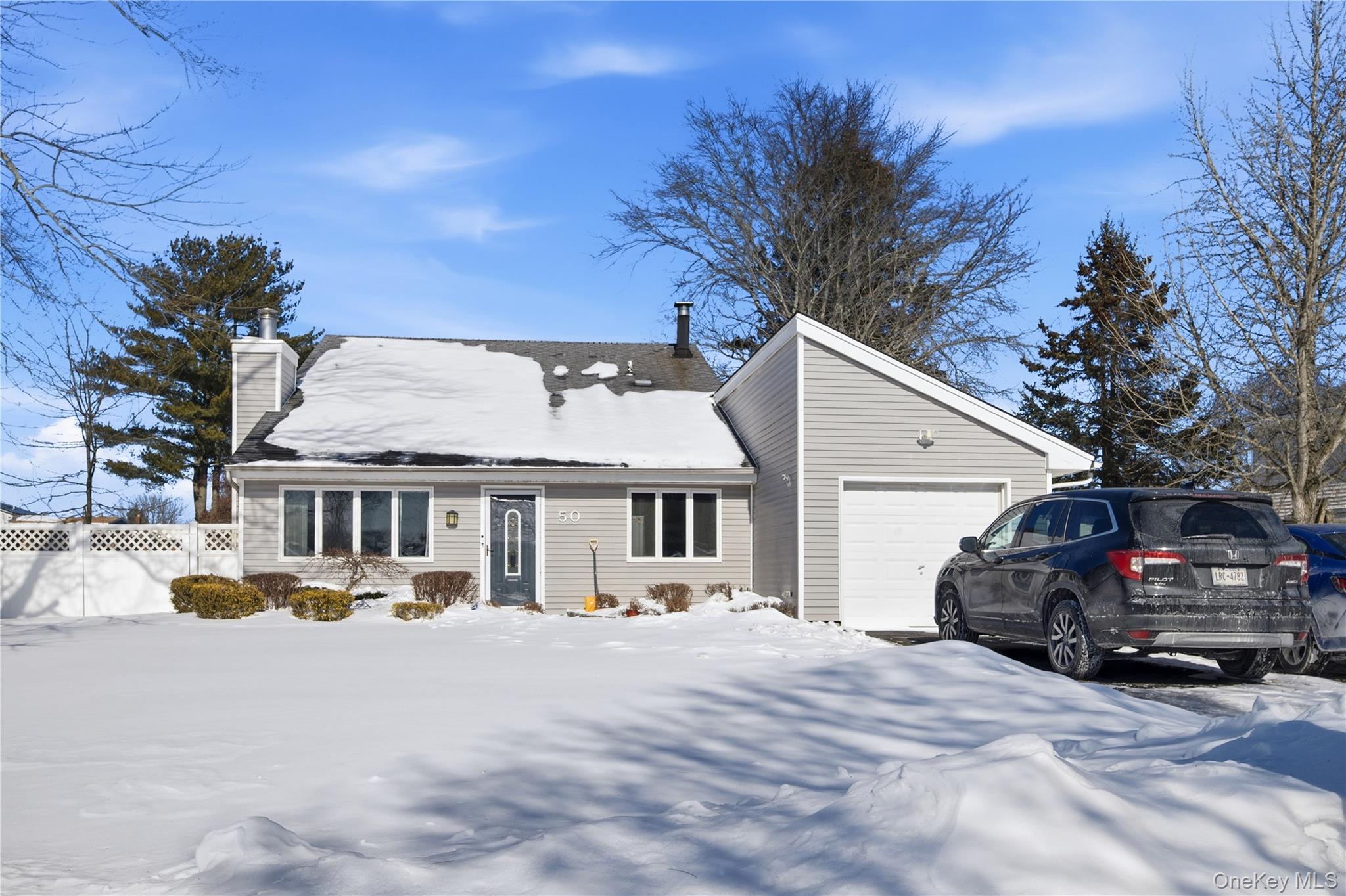 50 Rustic Avenue Medford, NY 11763 - Photo 2 of 20 a view of a car park in front of house