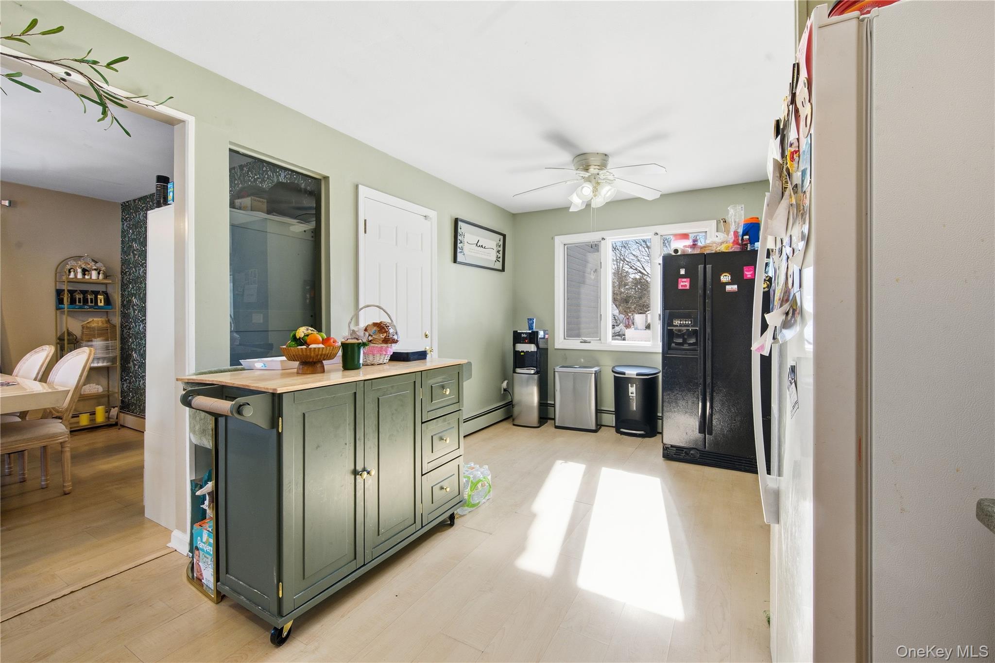 50 Rustic Avenue Medford, NY 11763 - Photo 5 of 20 a kitchen with stainless steel appliances kitchen island granite countertop a refrigerator and a sink