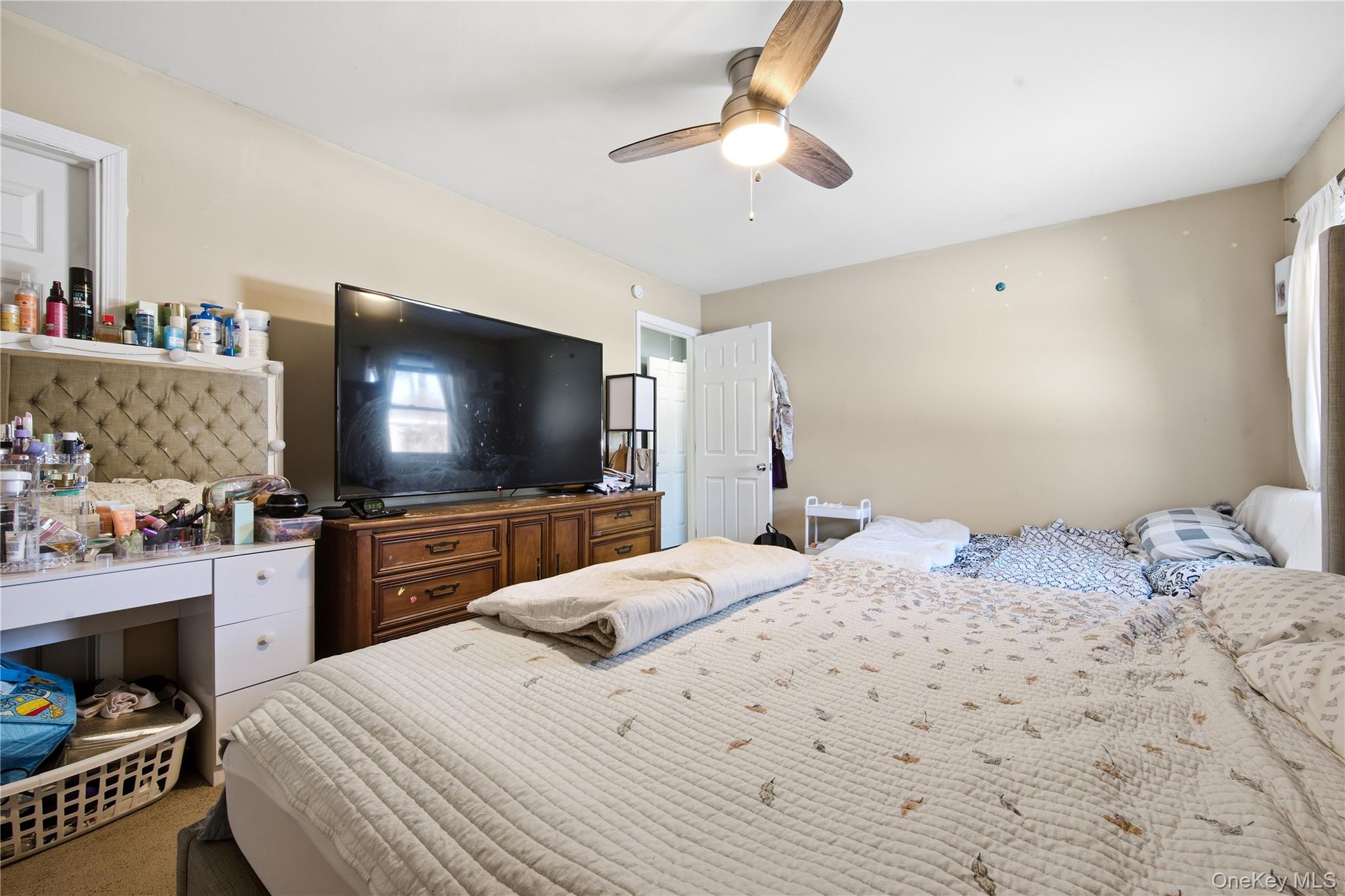 50 Rustic Avenue Medford, NY 11763 - Photo 9 of 20 a bedroom with a bed and a flat screen tv