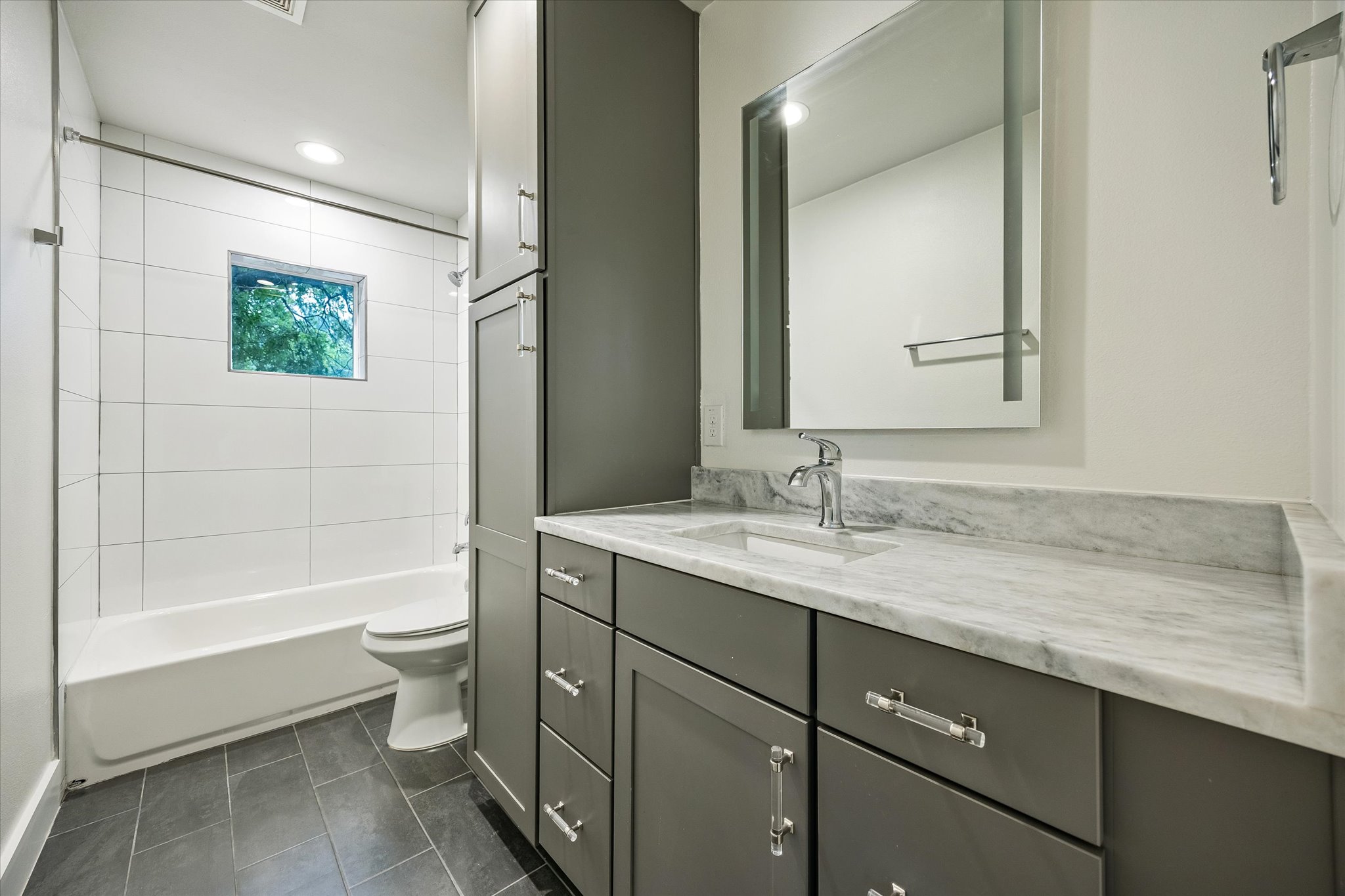 1224 Eleanor Street, Unit 1 Austin, TX 78721 - Photo 14 of 18 a bathroom with a granite countertop sink toilet and shower
