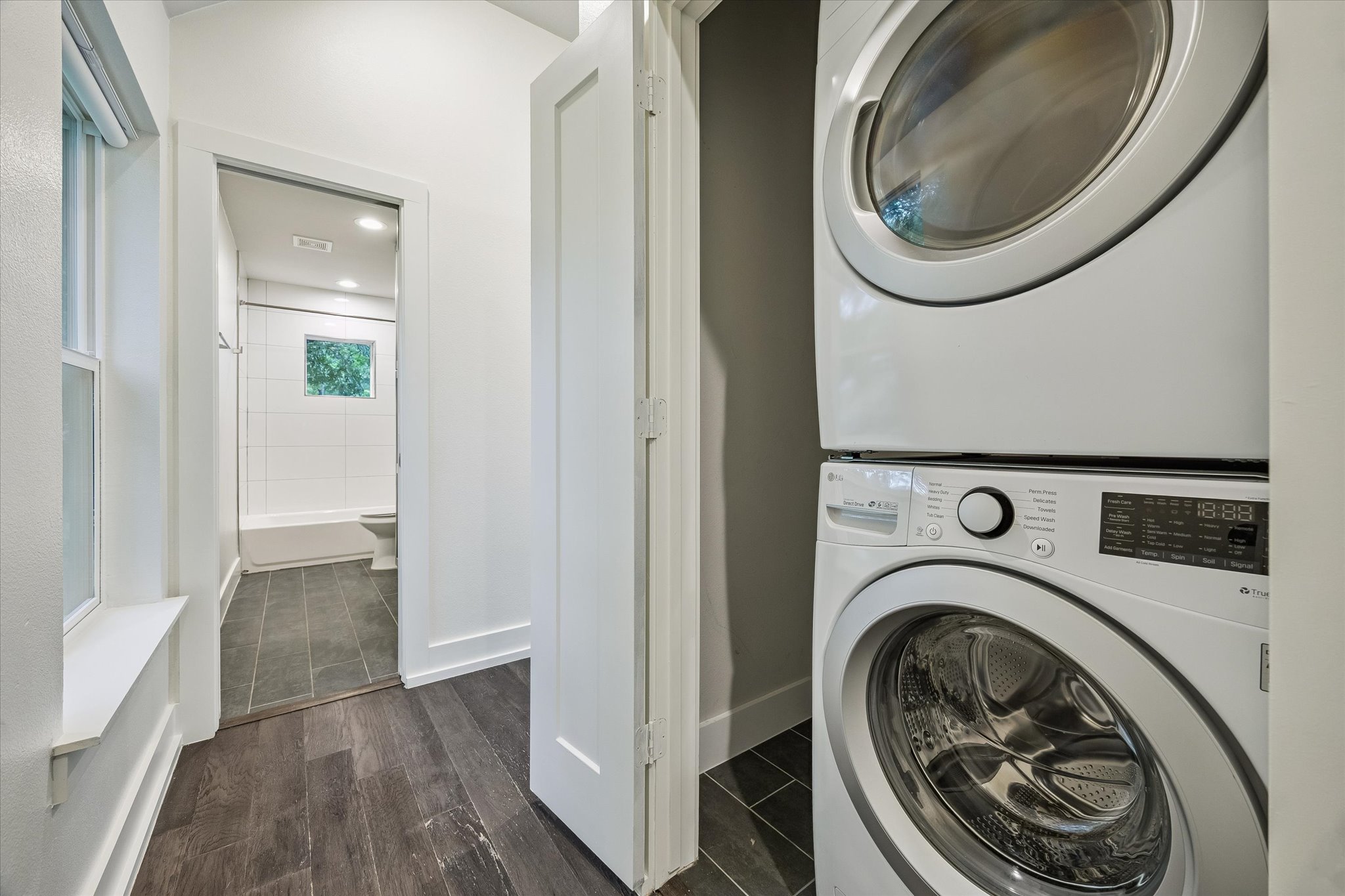 1224 Eleanor Street, Unit 1 Austin, TX 78721 - Photo 16 of 18 a view of a hallway with washer and dryer