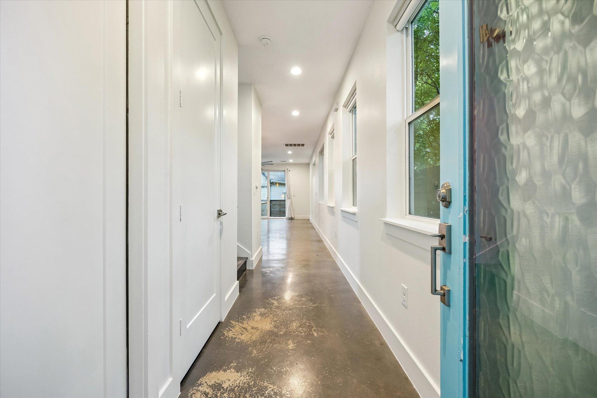 1224 Eleanor Street, Unit 1 Austin, TX 78721 - Photo 2 of 18 a view of a hallway with wooden floor