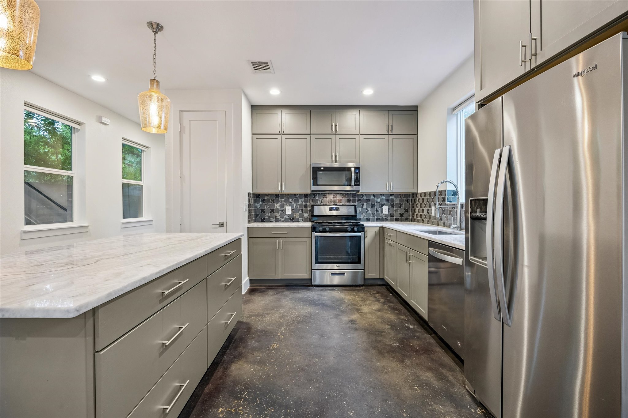 1224 Eleanor Street, Unit 1 Austin, TX 78721 - Photo 4 of 18 a kitchen with a refrigerator a sink and dishwasher
