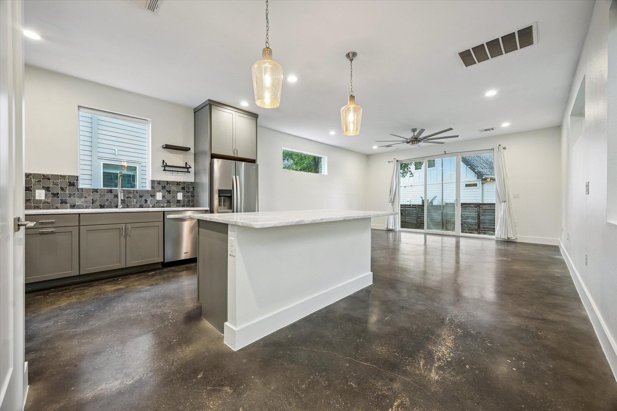 1224 Eleanor Street, Unit 1 Austin, TX 78721 - Photo 6 of 18 a view of a kitchen with a sink and dishwasher cabinet