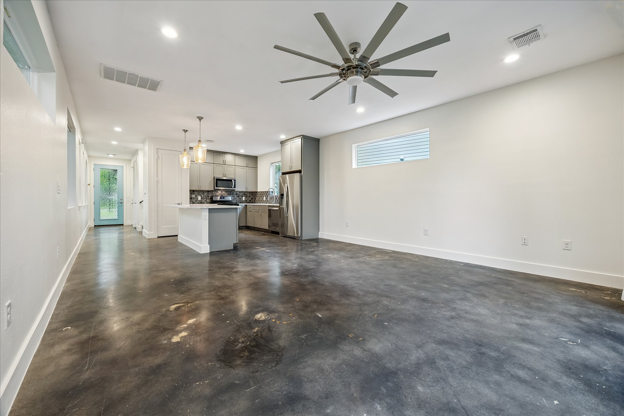1224 Eleanor Street, Unit 1 Austin, TX 78721 - Photo 9 of 18 a view of a kitchen with a sink and a refrigerator