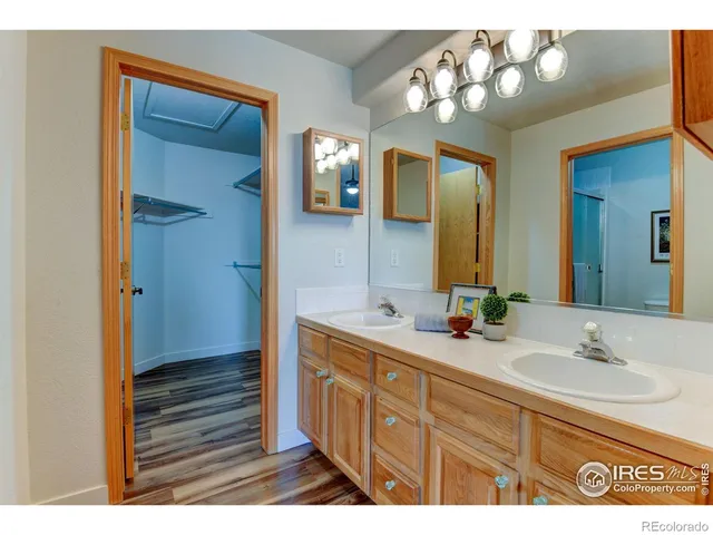 a bedroom with a bed and a view of living room