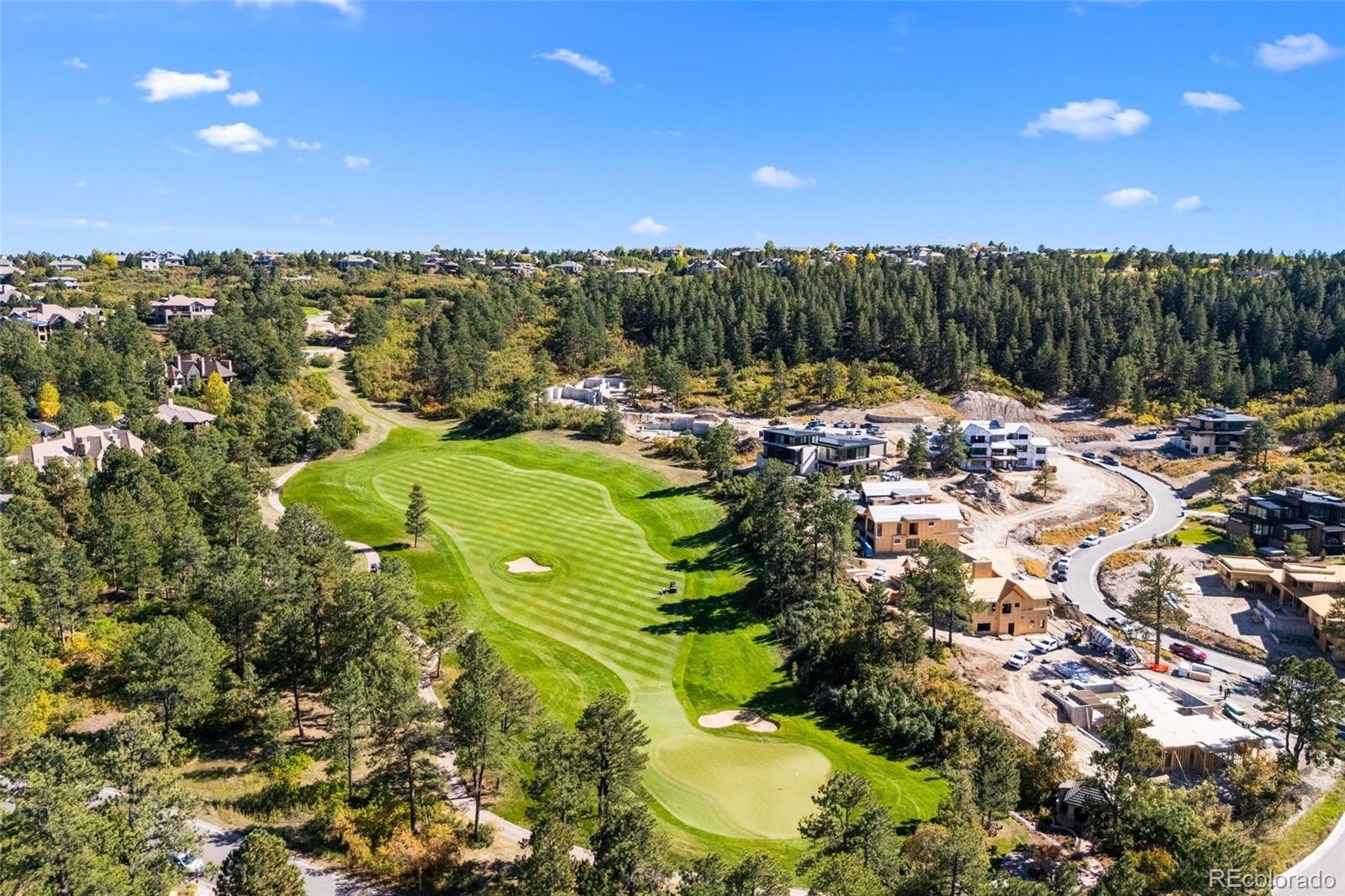 a view of a swimming pool with a patio and a yard