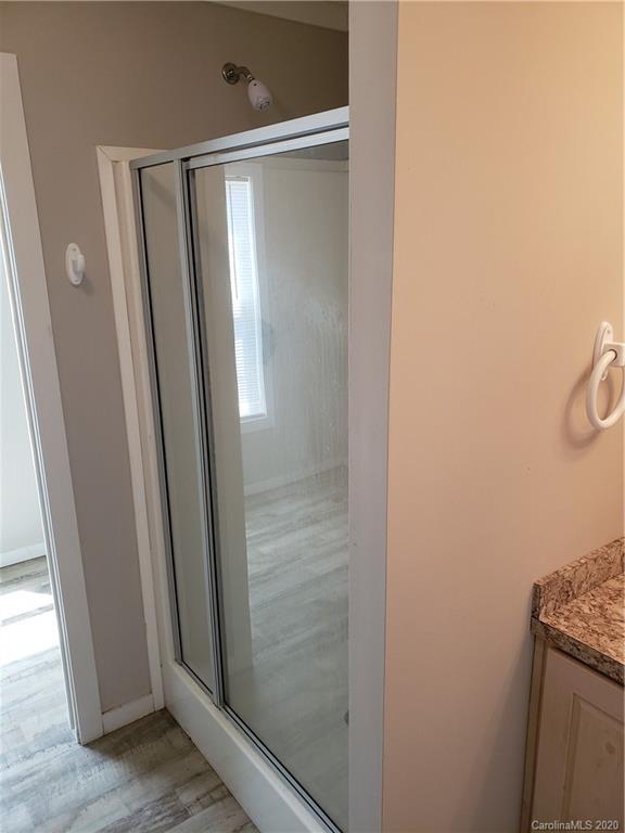 1224 Daniel Road, Unit A York, SC 29745 - Photo 22 of 33 a bathroom with a glass door shower