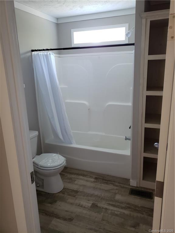 1224 Daniel Road, Unit A York, SC 29745 - Photo 23 of 33 a bathroom with a toilet and a tub