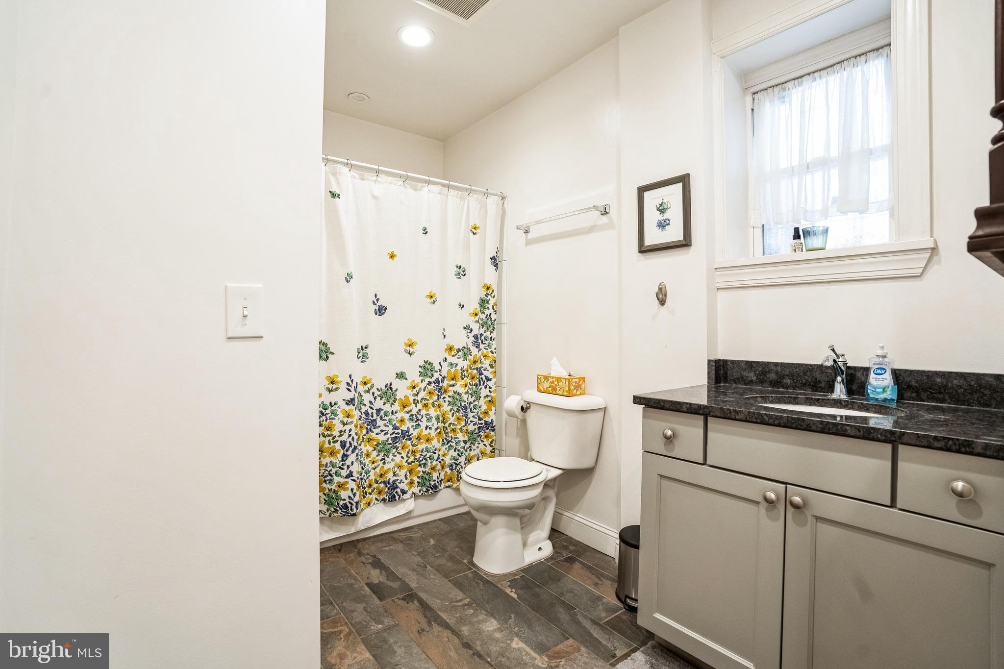2124 Spruce Street, Unit 1R Philadelphia, PA 19103 - Photo 12 of 17 a white toilet sitting next to a bathroom sink