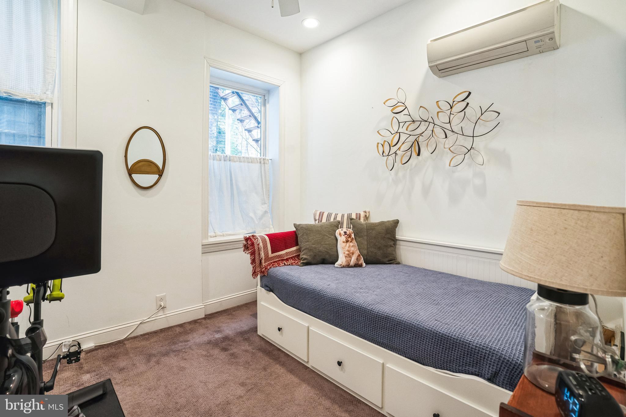 2124 Spruce Street, Unit 1R Philadelphia, PA 19103 - Photo 14 of 17 a living room with furniture