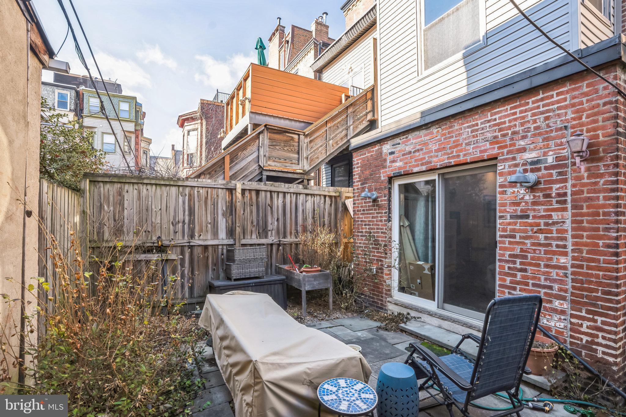 2124 Spruce Street, Unit 1R Philadelphia, PA 19103 - Photo 16 of 17 a view of a patio with a table and chairs