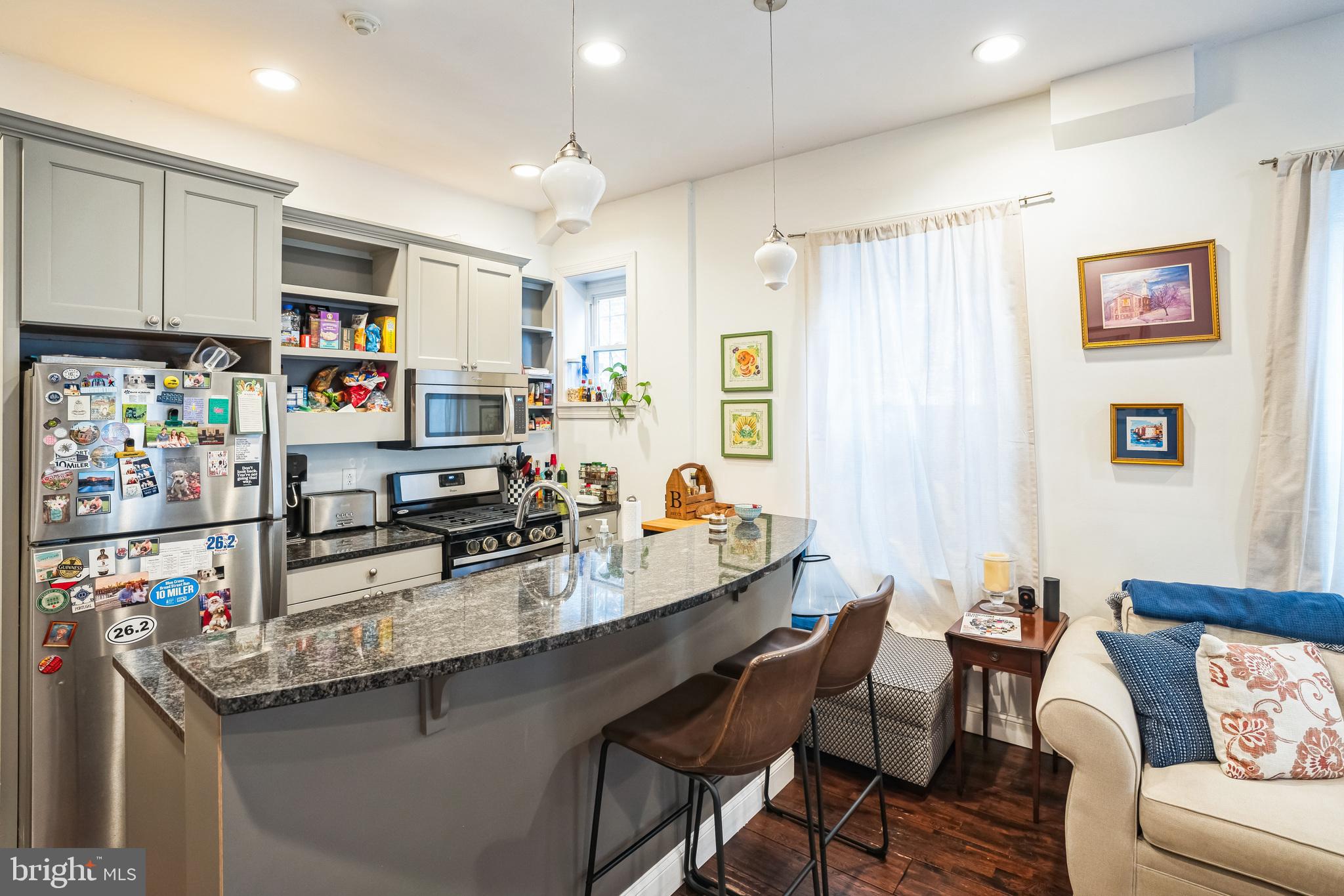 2124 Spruce Street, Unit 1R Philadelphia, PA 19103 - Photo 3 of 17 a kitchen with granite countertop a sink cabinets and window
