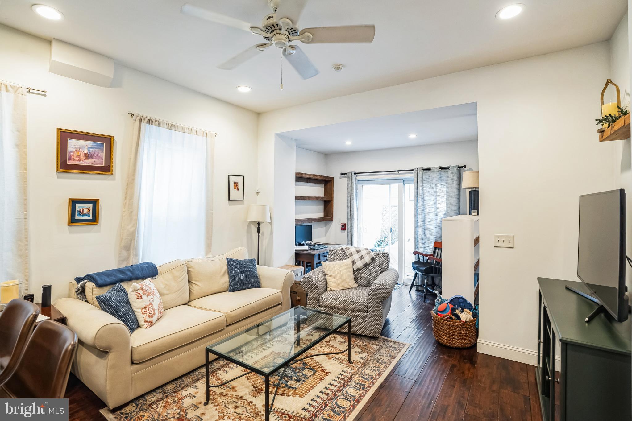 2124 Spruce Street, Unit 1R Philadelphia, PA 19103 - Photo 5 of 17 a living room with furniture a flat screen tv and a window