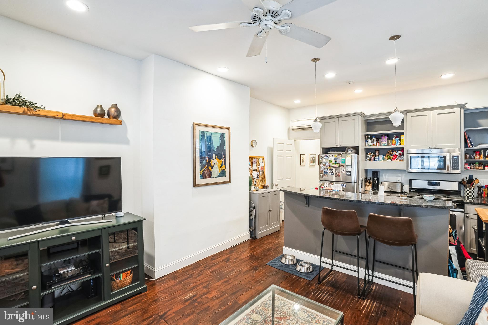 2124 Spruce Street, Unit 1R Philadelphia, PA 19103 - Photo 9 of 17 a living room with furniture and a flat screen tv