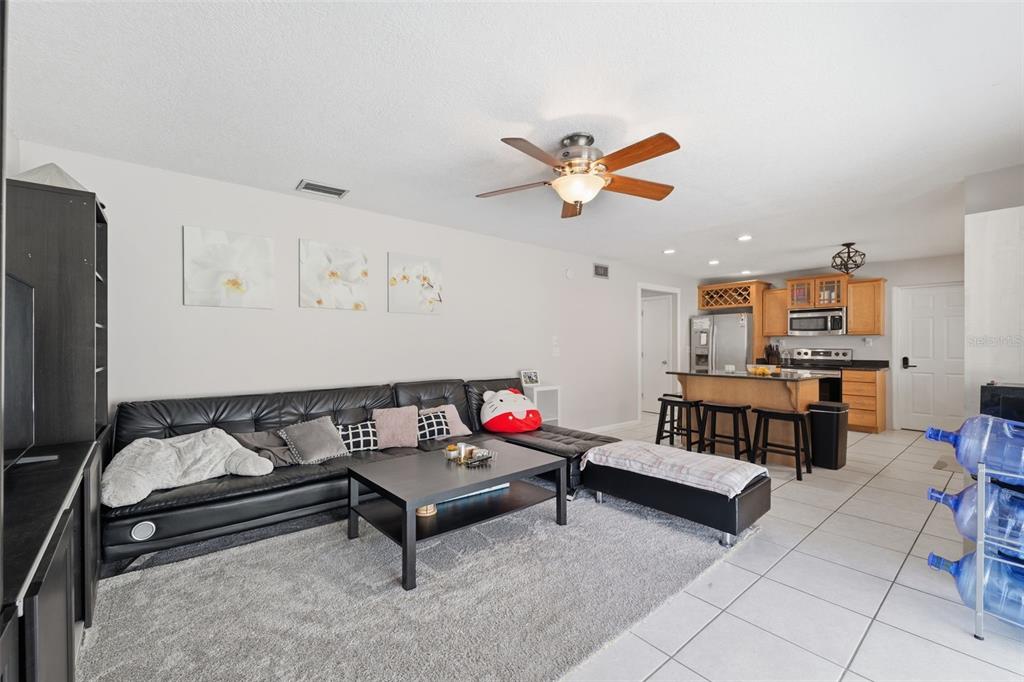 12935 Rain Forest Street Temple Terrace, FL 33617 - Photo 17 of 51 a living room with furniture and kitchen view