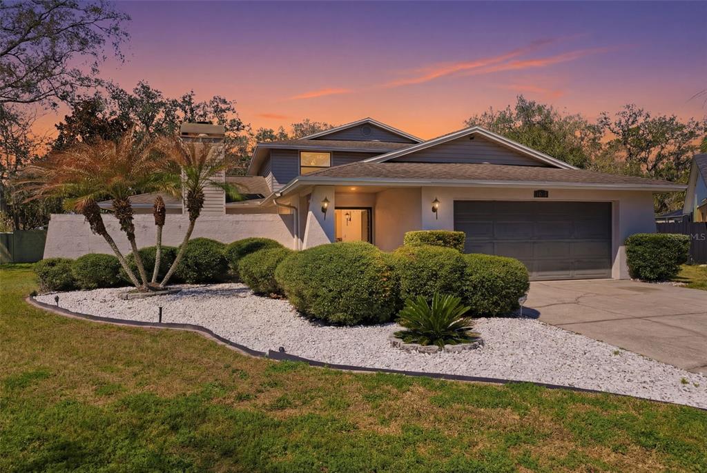 12935 Rain Forest Street Temple Terrace, FL 33617 - Photo 2 of 51 a front view of a house with a yard