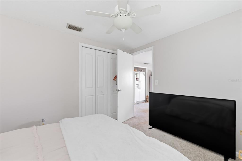 12935 Rain Forest Street Temple Terrace, FL 33617 - Photo 25 of 51 a bedroom with a bed and a tv