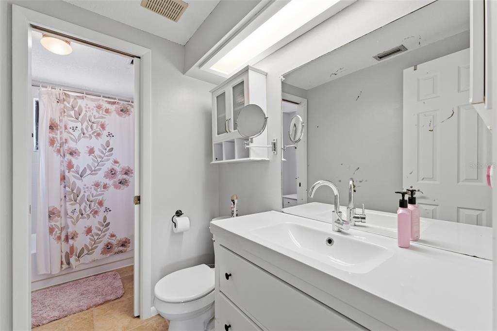 12935 Rain Forest Street Temple Terrace, FL 33617 - Photo 26 of 51 a bathroom with a sink toilet and shower