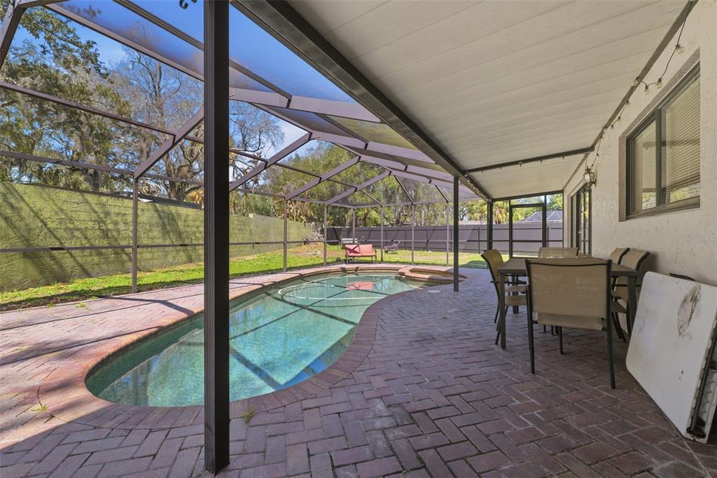 12935 Rain Forest Street Temple Terrace, FL 33617 - Photo 35 of 51 a view of a swimming pool with a porch