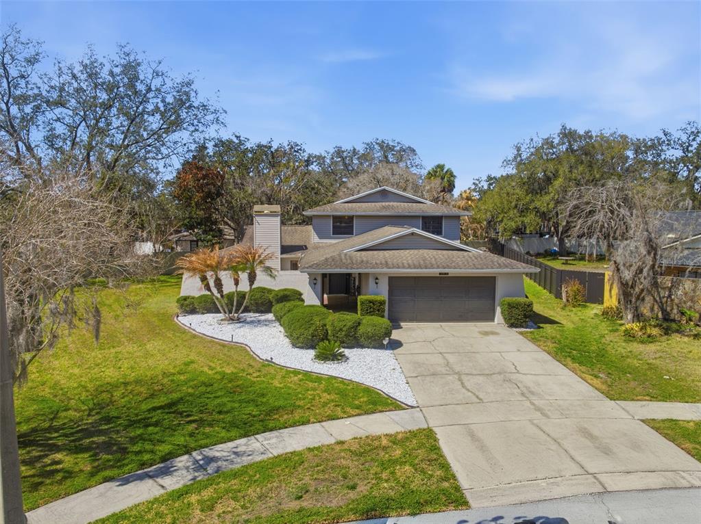12935 Rain Forest Street Temple Terrace, FL 33617 - Photo 41 of 51 a front view of a house with a yard