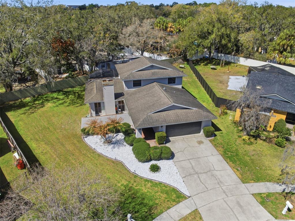 12935 Rain Forest Street Temple Terrace, FL 33617 - Photo 43 of 51 an aerial view of a house with a garden and lake view