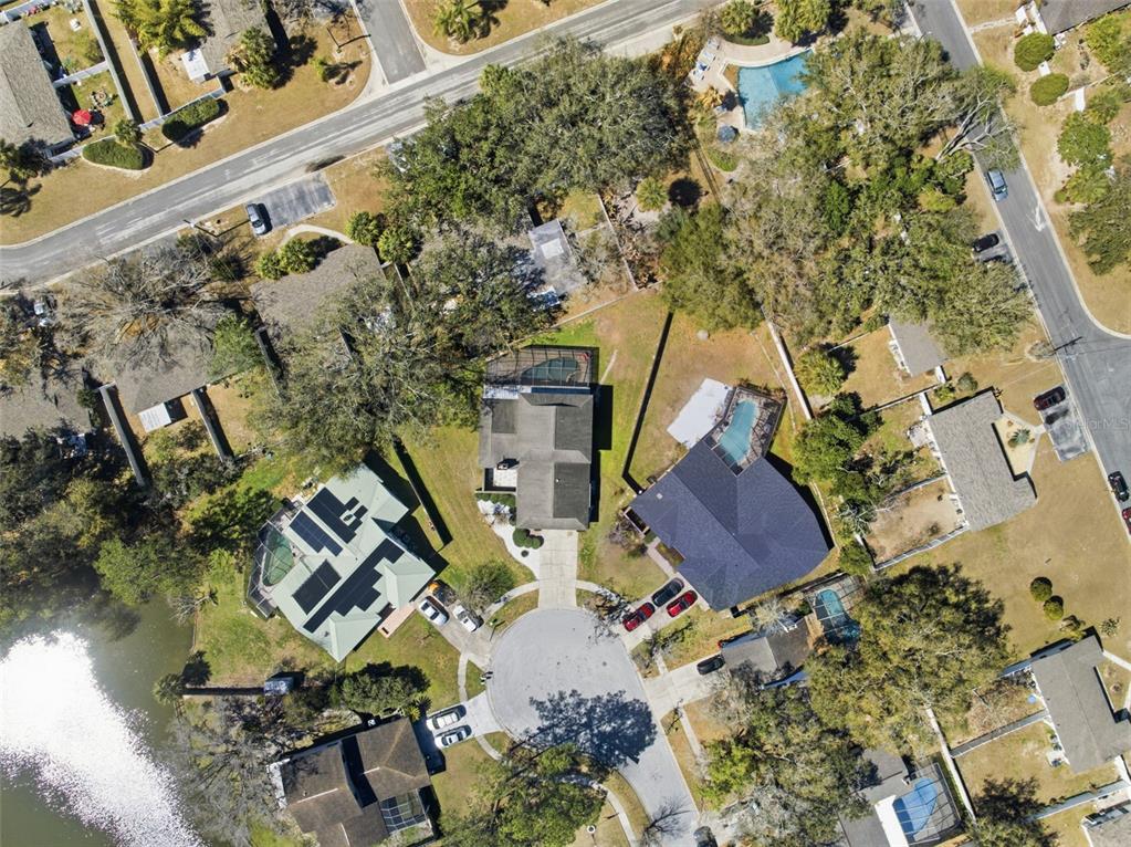 12935 Rain Forest Street Temple Terrace, FL 33617 - Photo 47 of 51 an aerial view of a house with outdoor space and a lake view