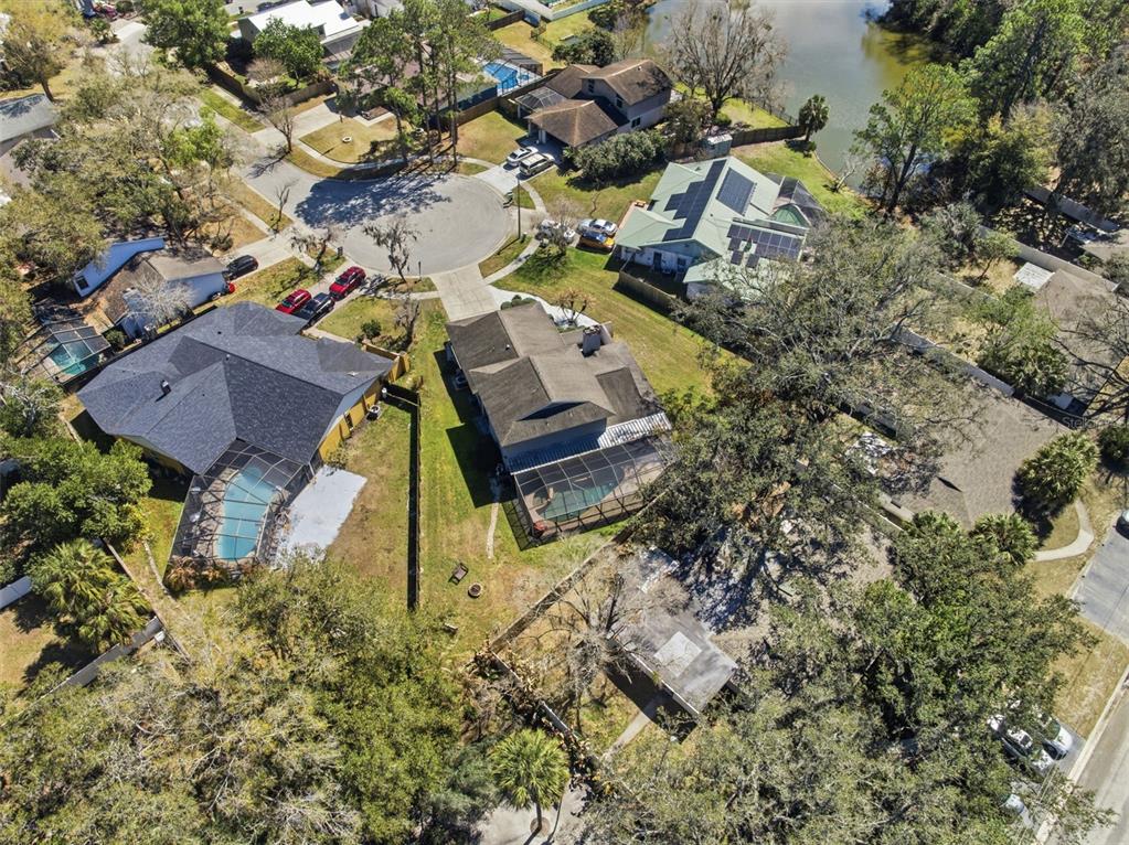 12935 Rain Forest Street Temple Terrace, FL 33617 - Photo 51 of 51 an aerial view of a house with a yard and trees