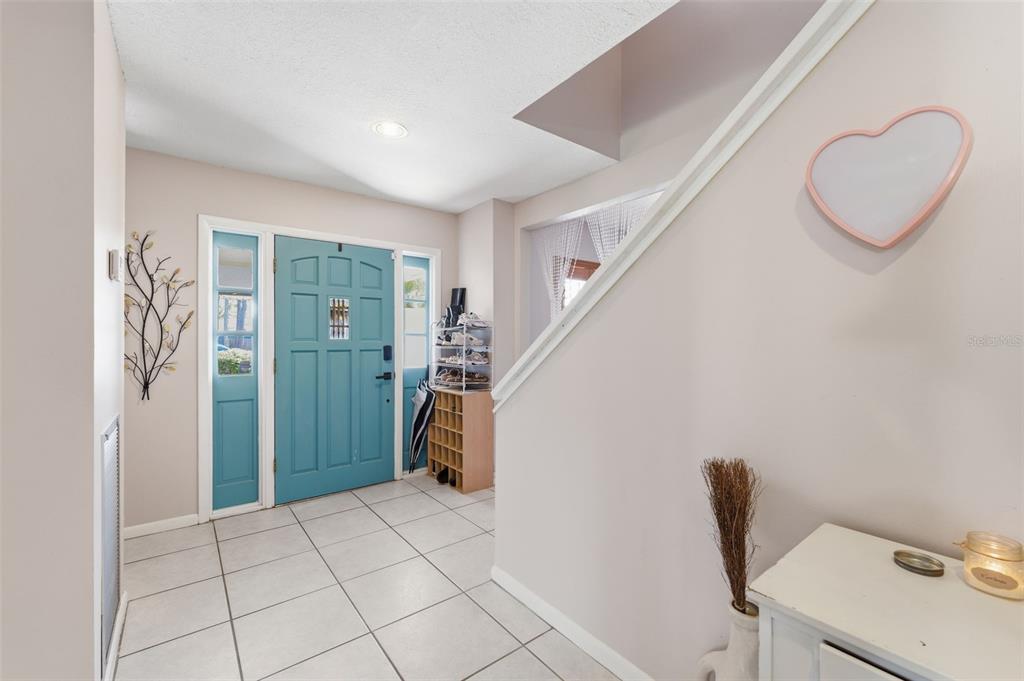 12935 Rain Forest Street Temple Terrace, FL 33617 - Photo 8 of 51 a view of room with stairs and a window