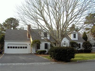 185 Indian Hill Road Barnstable, MA 02630 - Photo 1 of 10 a front view of a house with a garden