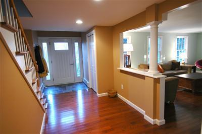 185 Indian Hill Road Barnstable, MA 02630 - Photo 2 of 10 a view of a hallway with wooden floor and stairs