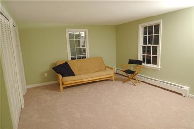 185 Indian Hill Road Barnstable, MA 02630 - Photo 8 of 10 a living room with a couch and a window