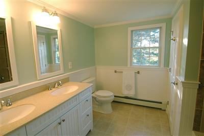 185 Indian Hill Road Barnstable, MA 02630 - Photo 10 of 10 a bathroom with a granite countertop toilet a sink and a mirror