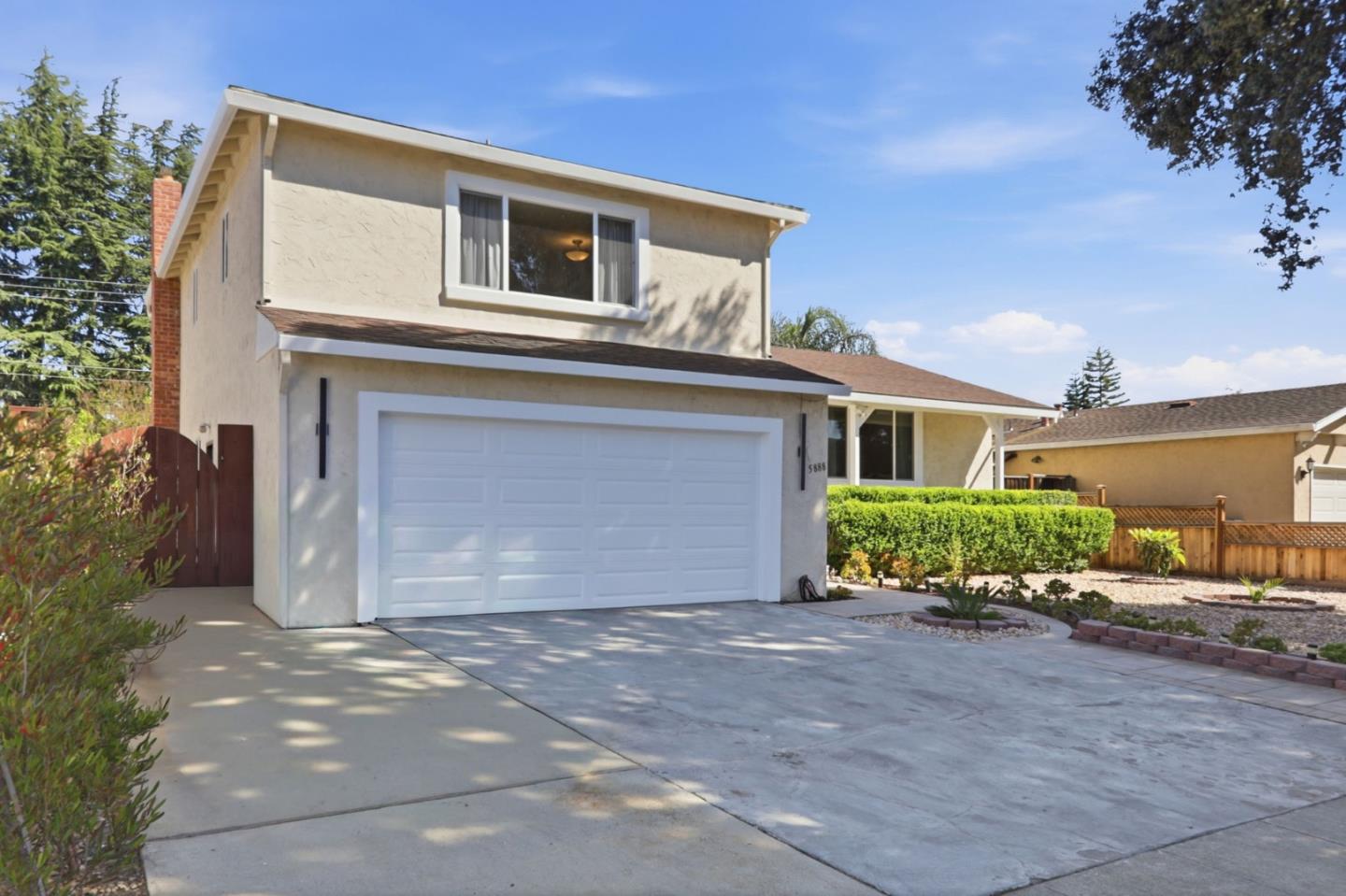 5888 Lean Way San Jose, CA 95123 - Photo 3 of 54 a front view of a house with a yard and garage